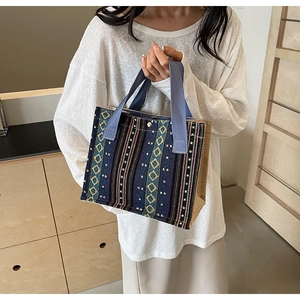 Close-up of ethnic tote bag showing geometric weaving, durable fabric and magnetic clasp
