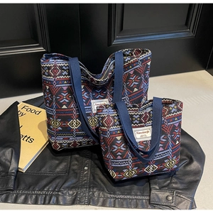 Detail showing two sizes of bohemian geometric canvas tote bags with navy handles
