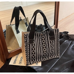 Detail view of ethnic style canvas tote bag with black and white geometric pattern