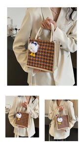 Detailed shot of vintage houndstooth linen tote with woven rope handle and plush charm