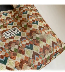 Macro shot of geometric jacquard fabric texture on a bohemian canvas tote bag detail