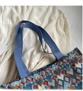 Detail of colorful geometric woven fabric and durable blue wide textile handles