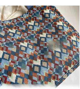 Detail of bohemian tote bag with colorful geometric woven fabric and texture