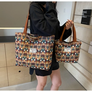 Detail of bohemian jacquard tote bags showing geometric patterns and woven handles