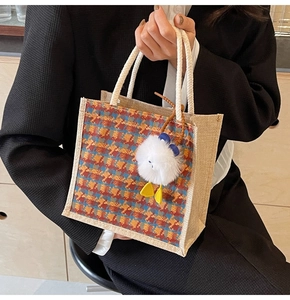 Linen bento tote bag with colorful plaid pattern and a cute plush duck charm