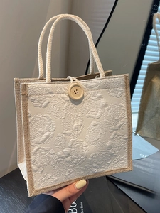 Linen tote bag for women featuring white 3D rose jacquard fabric and cotton rope handles