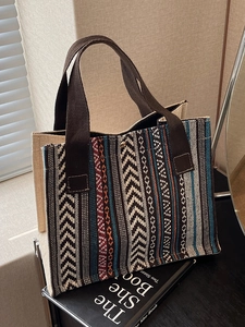 Ethnic woven tote bag with colorful geometric patterns and durable brown handles