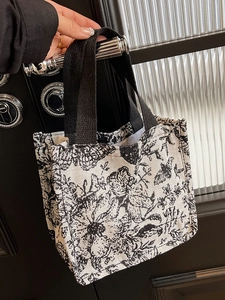 Floral canvas tote bag with black wide straps and vintage botanical pattern for women
