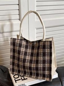 Brown checkered woven tote bag with cotton rope handles on a clean white background