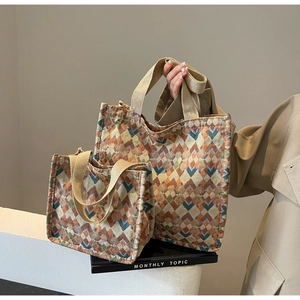 Detail of bohemian canvas tote bags showing geometric jacquard patterns in two sizes