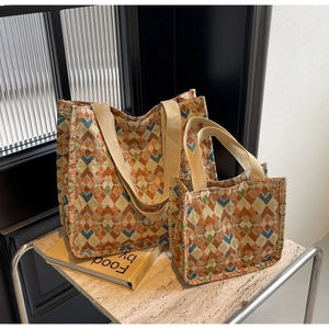 Detailed comparison of large and small bohemian tote bags with colorful geometric patterns