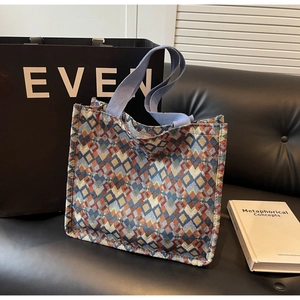Close-up of bohemian jacquard woven tote bag featuring colorful geometric patterns