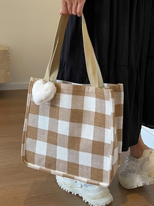 Brown and white checkered oversized tote bag with plush heart charm for commuting