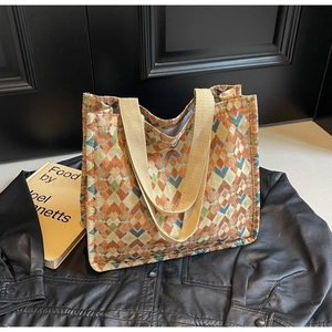 Detailed macro view of bohemian jacquard tote bag with geometric rhombus patterns