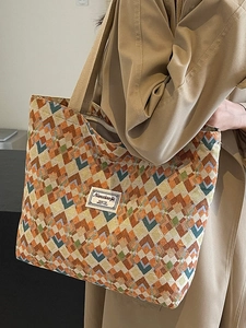 Bohemian geometric knit tote bag with colorful zig-zag patterns for daily commute