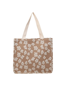 Floral canvas tote bag with brown textured fabric and white handles for commuting