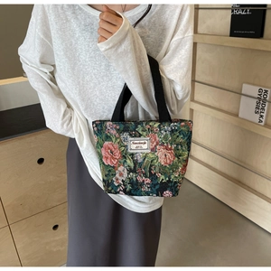 Close-up of vintage floral tapestry canvas tote bag featuring premium woven texture