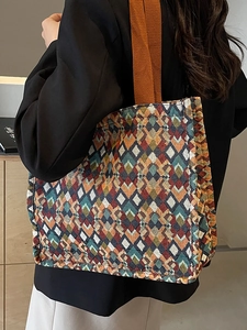 Bohemian geometric woven tote bag with wide brown shoulder strap for women