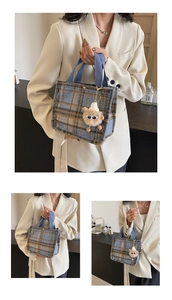 Detail shot of plaid wool tote bag with blue straps and cute plush bear accessory