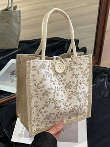Borsa da pranzo in juta floreale con manici intrecciati e decorazione a bottone