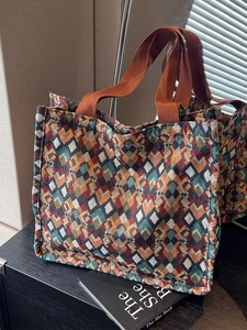 Bohemian tote bag with colorful geometric patterns and durable orange woven straps