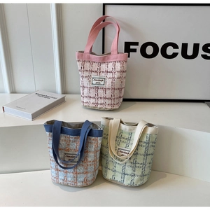 Detailed collection of checkered corduroy bucket bags in pink, blue, and yellow colors