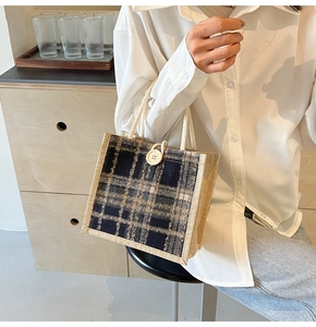 Detail of retro plaid linen tote bag featuring woven texture and cotton rope handles
