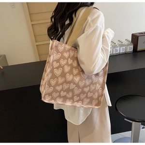 Detailed shot of large capacity tote bag with white heart pattern for women