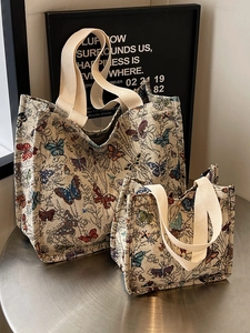 Large butterfly jacquard tote bag with woven handles on artistic metallic background