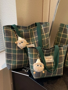 Classic green and yellow plaid canvas tote bags with cute plush charms and top handles
