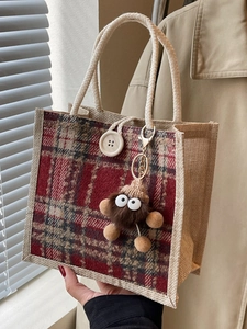 Linen tote bag with red plaid panels, braided handles, and a cute plush bear charm
