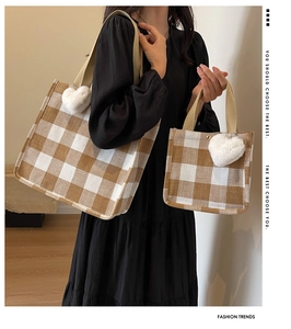 Size comparison of large and small check canvas tote bags with plush heart charms