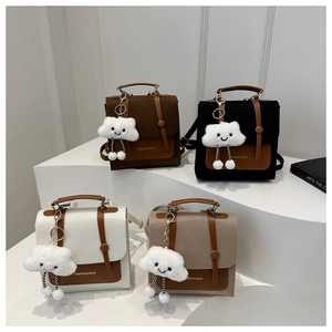 Detailed display of four retro felt mini backpacks in brown, black, beige, and tan colors