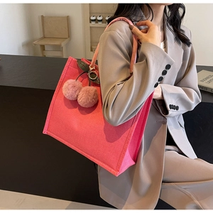 Pink canvas tote bag with cherry pom-pom charm and thick textured linen fabric details