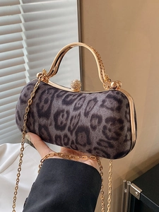 Retro leopard print handbag with golden metal handle and rhinestone clasp closure