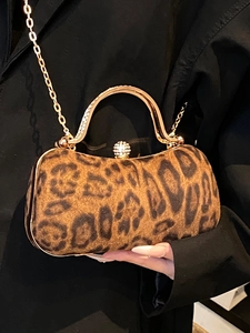 Chic leopard print evening clutch bag with gold metal handle and rhinestone closure