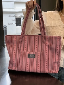 Pink striped corduroy tote bag with large capacity and dual handles for daily use