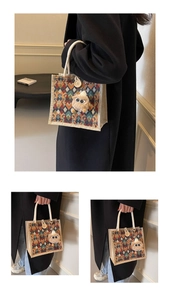 Detail of waterproof linen tote bag with colorful geometric patterns and plush eye charm