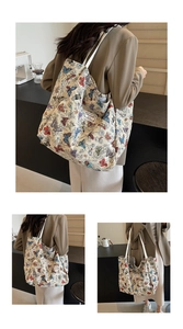 Macro shot of large canvas tote bag featuring colorful butterfly patterns and handles