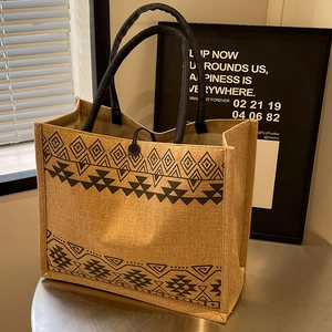 Large capacity woven jute tote bag with ethnic patterns and black rope handles
