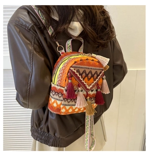 Detailed back view of a colorful ethnic woven mini backpack with vibrant tassels