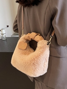 Furry plush handbag for women with ruched leather handle and stylish brand tag detail