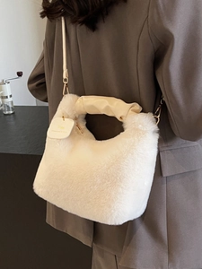 White fluffy plush handbag with pleated leather handles and detachable shoulder strap