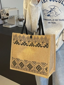 Large capacity woven tote bag with tribal geometric patterns and black handles