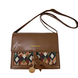 Retro brown crossbody bag with geometric woven details and adjustable shoulder strap