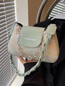 Fashionable light green baguette bag with landscape print and decorative floral chain