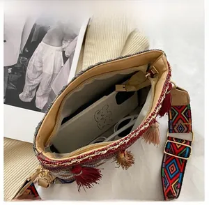 Internal view of ethnic woven crossbody bag showing space for phone and accessories