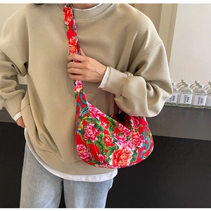 Detailed view of large ethnic floral crossbody bag with traditional peony and phoenix patterns