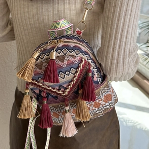 Ethnic bohemian mini backpack with colorful embroidery patterns and tassel details