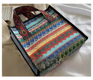 Close-up of vibrant bohemian woven tote bag with colorful geometric patterns and handles